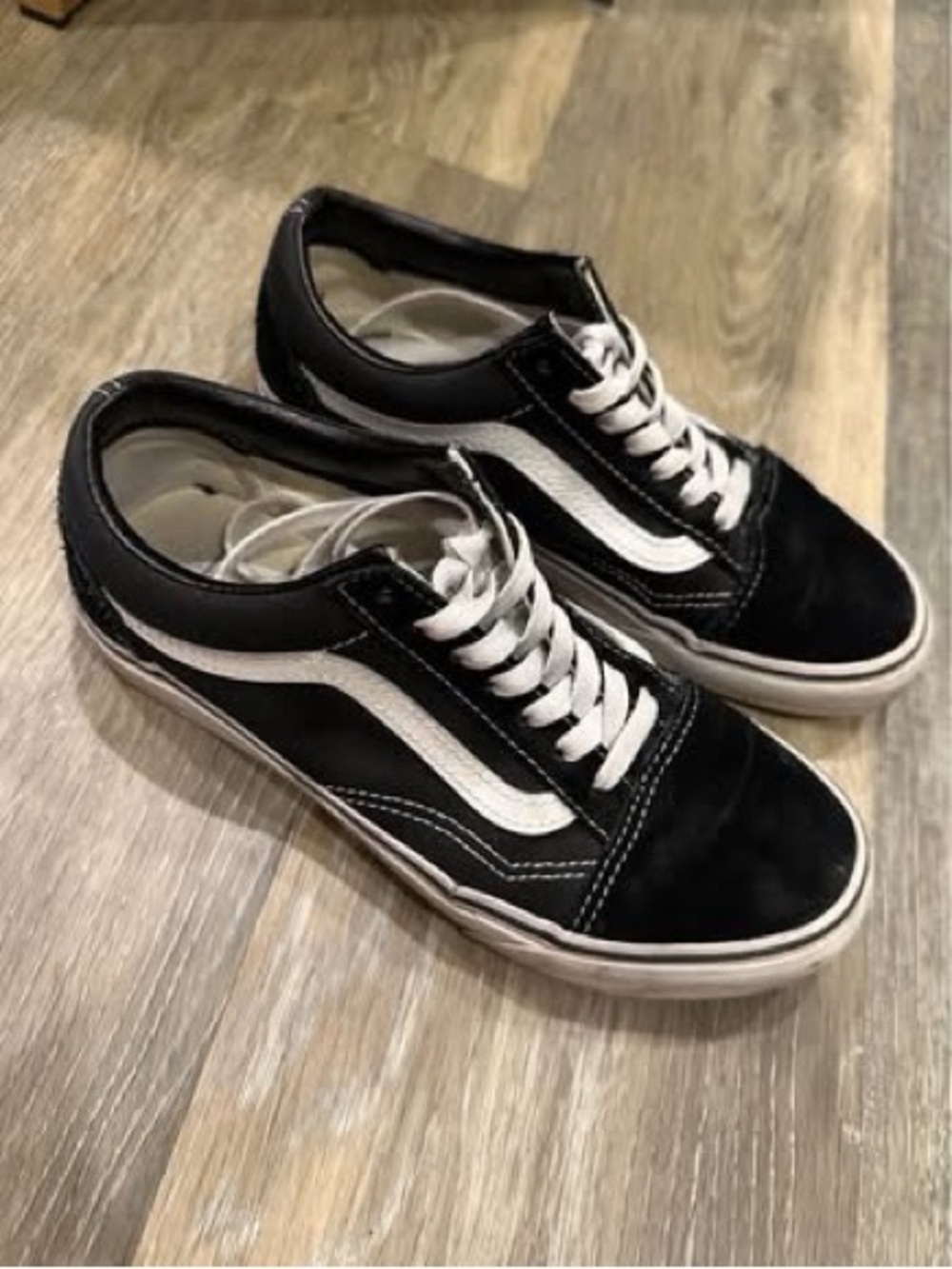 Women’s or men’s black and white low-top skate sneakers
